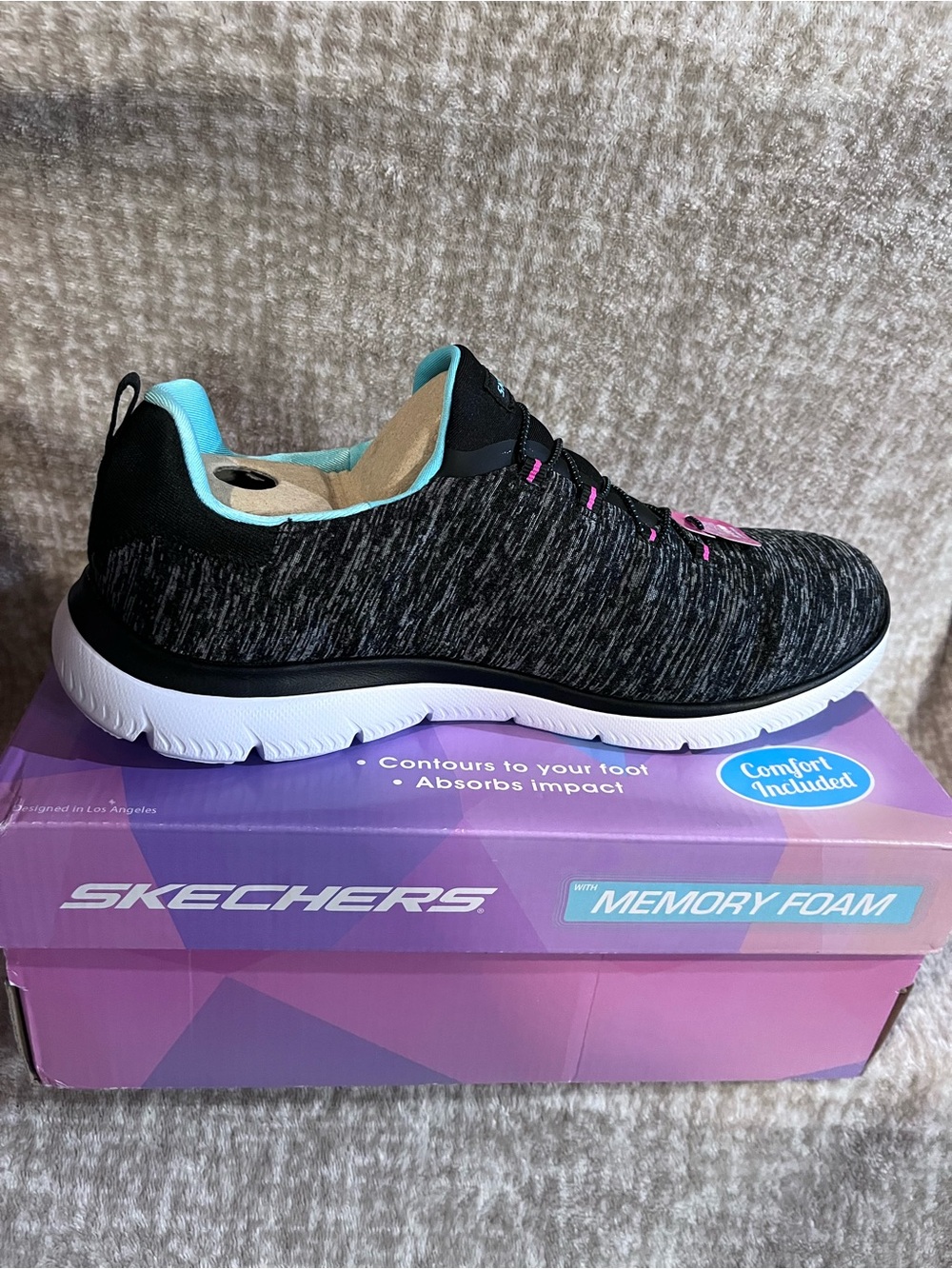 Skechers Women's Black Slip-On Sneaker with Aqua and Pink Accents